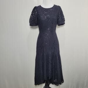 Yumi Kim Black Pixie Eyelet Lined Puff Short Sleeve Ruffle Hem Midi Dress XS